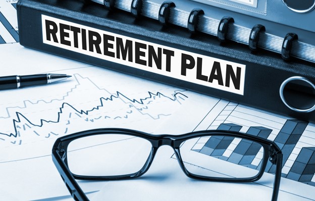 Folder with retirement plan and eyeglasses